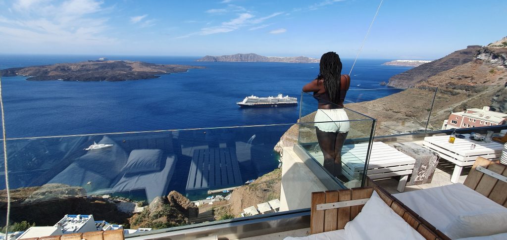 picture of Stef Barti with the beautiful Santorini caldera as a backdrop