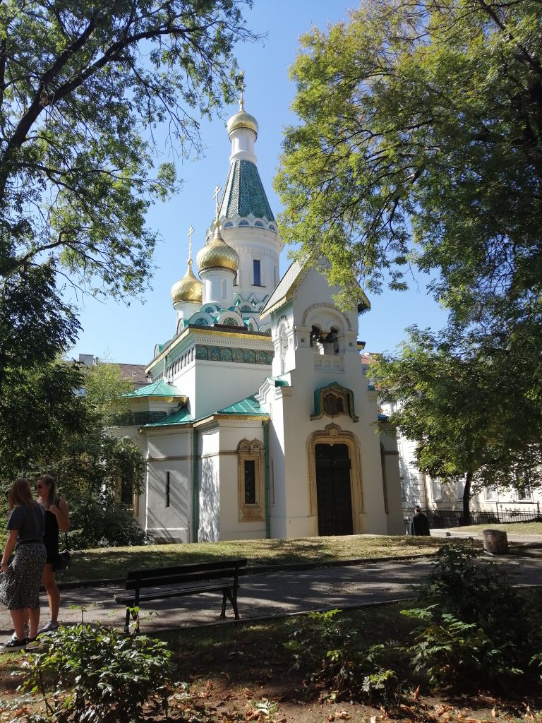 Stef Barti solo female travel in Sofia Bulgaria taking a picture of a church