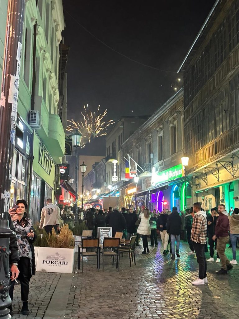 people celebrating New year in Bucharest old town