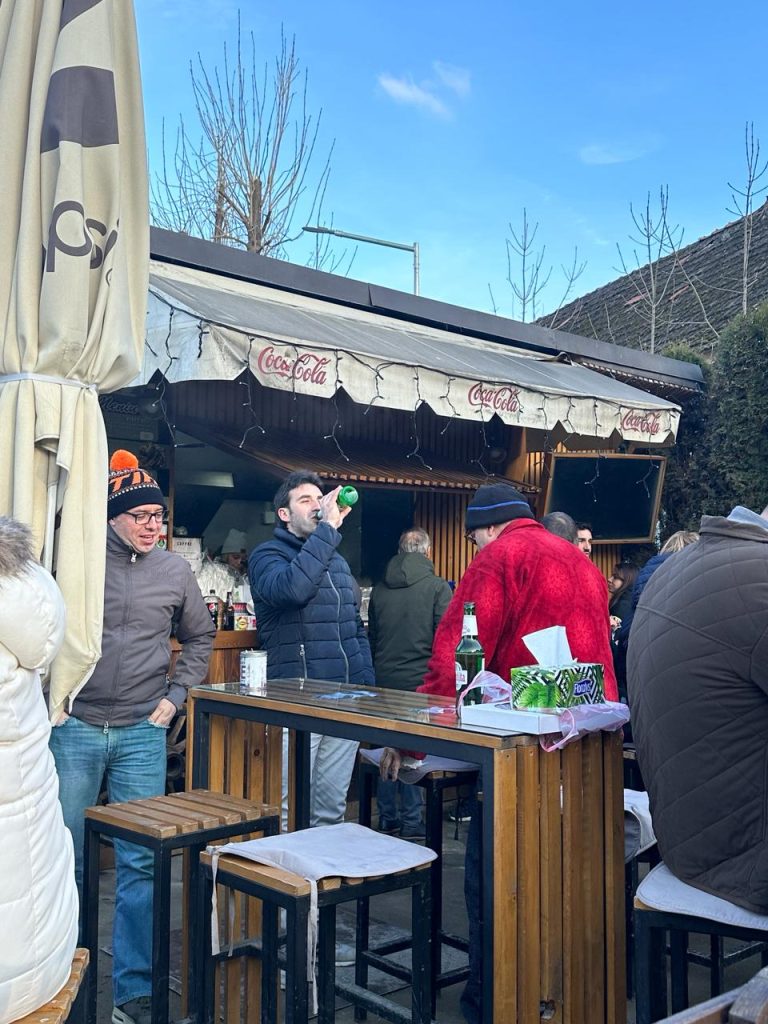 people having fun and drinking in town