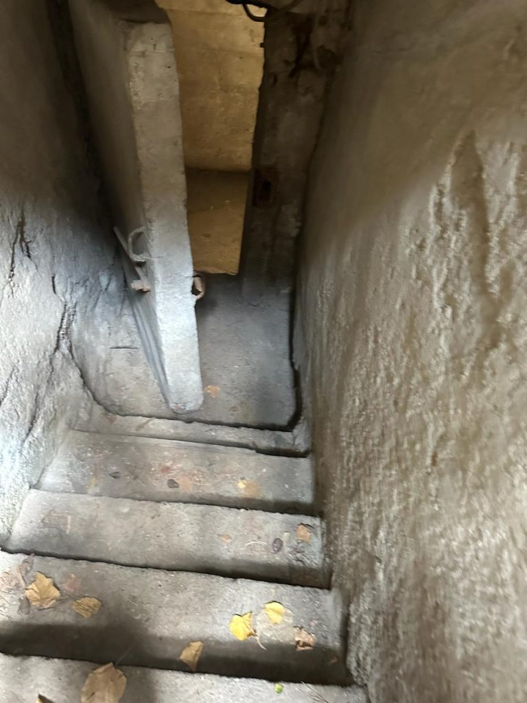 Stef Barti entering the Bunker underground of House of leaves museum in tirana