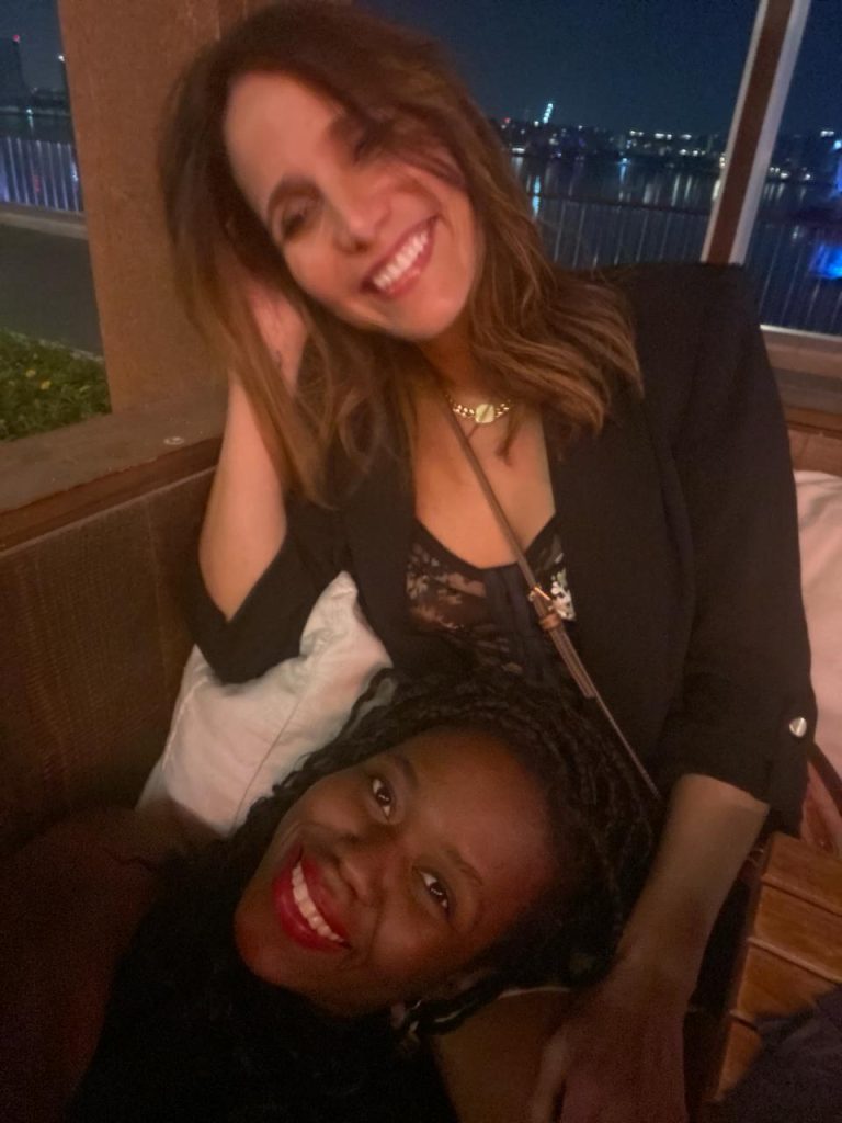 picture of two girls socializing at a bar, sisterhood