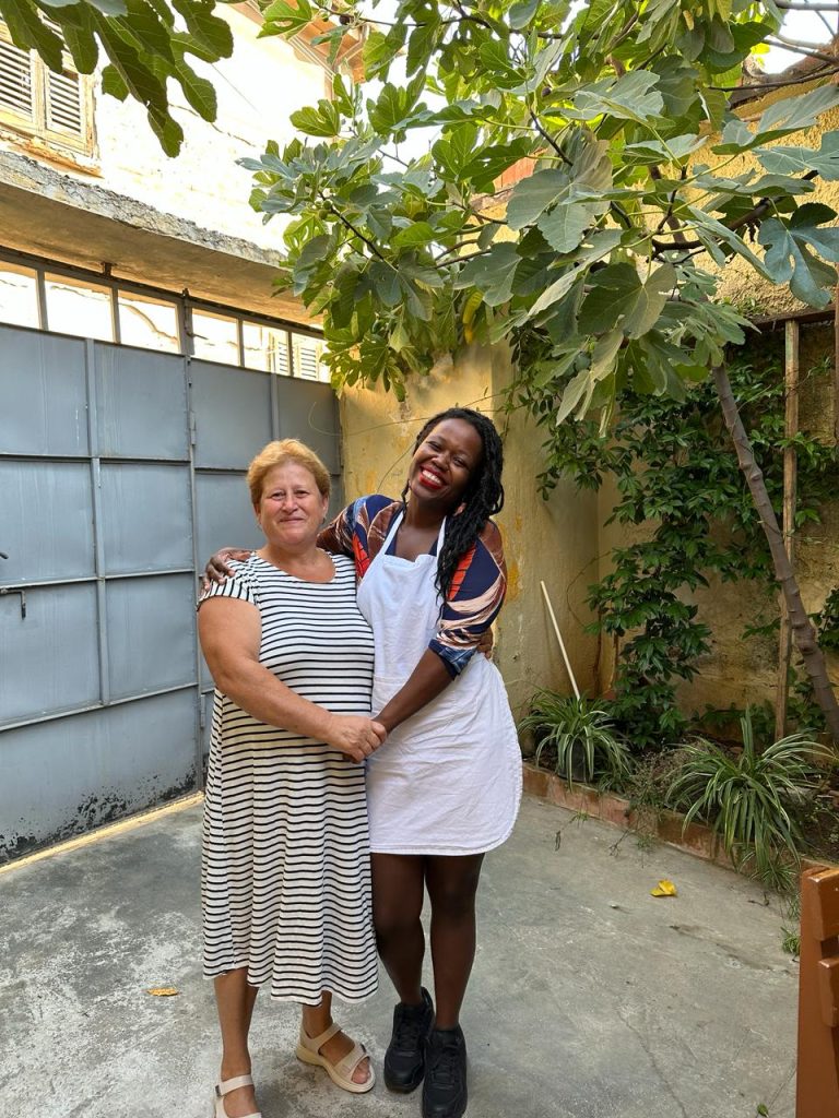 Stef Barti cooking class in Tirana, taking a picture with an Albanian grandmother