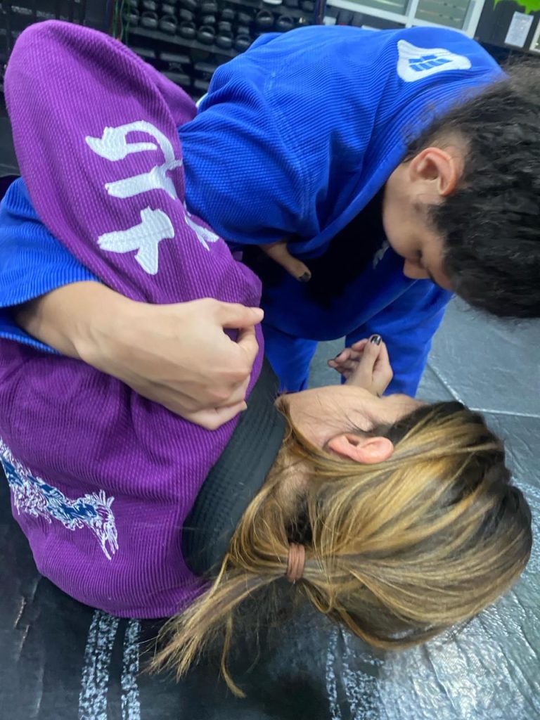 two girls doing Brazilian Jiu Jitsu Gi training
