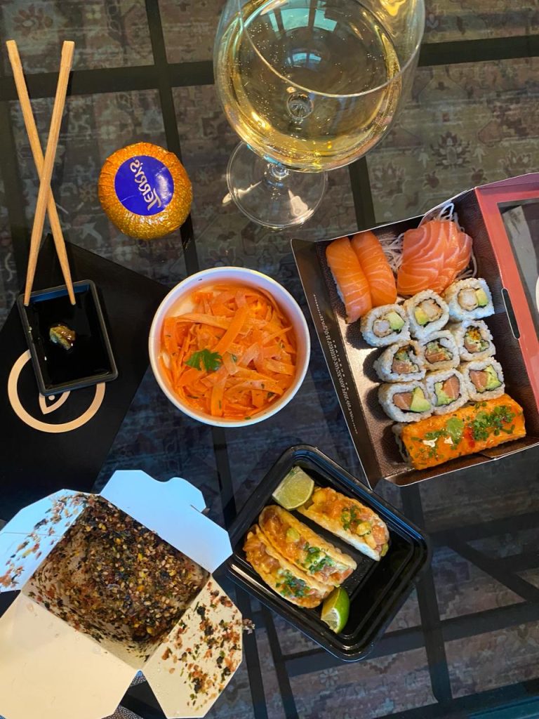 picture of a healthy meal with wine and sushi