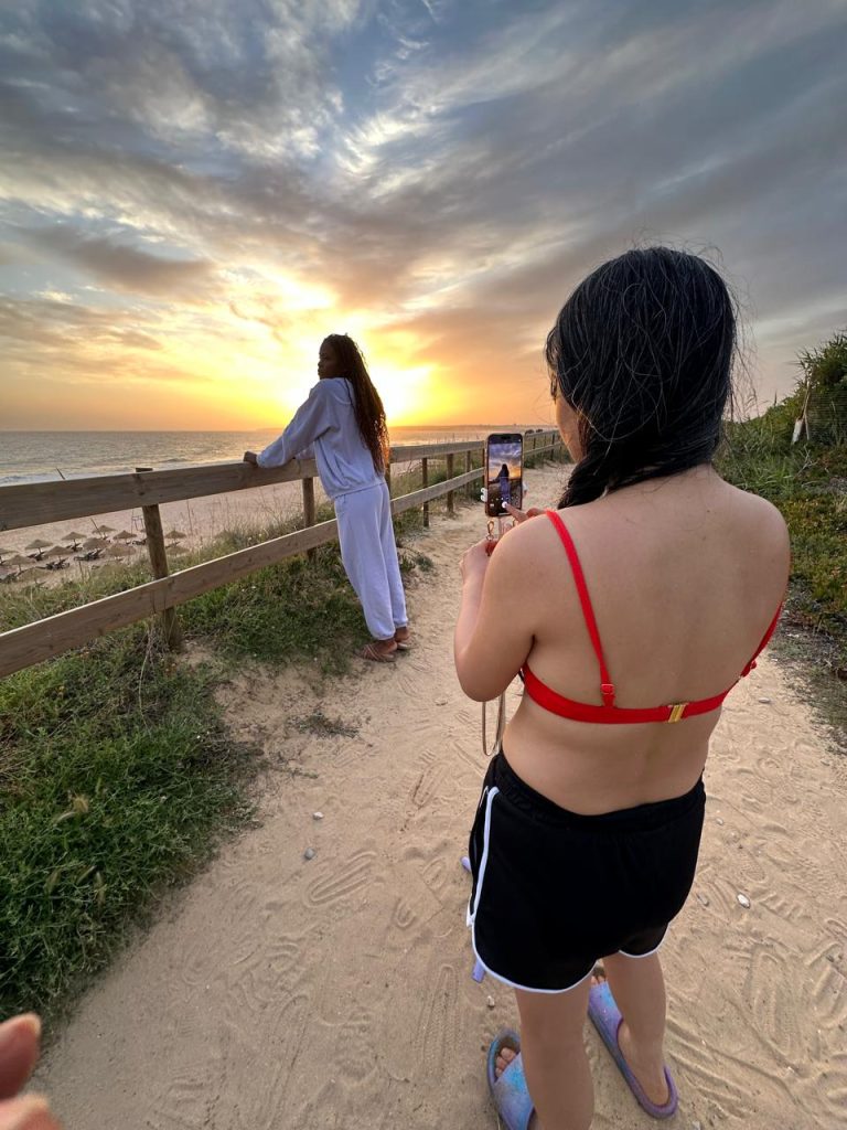 girls taking selfie albufeira sunset