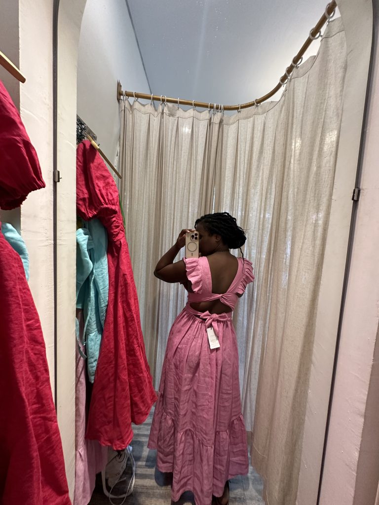 Stef Barti trying on linen dresses at Samara Store in Ubud Bali