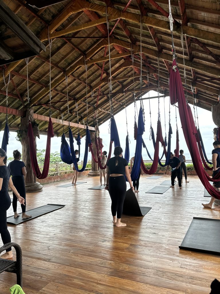 Trying aerial yoga at Udara Bali