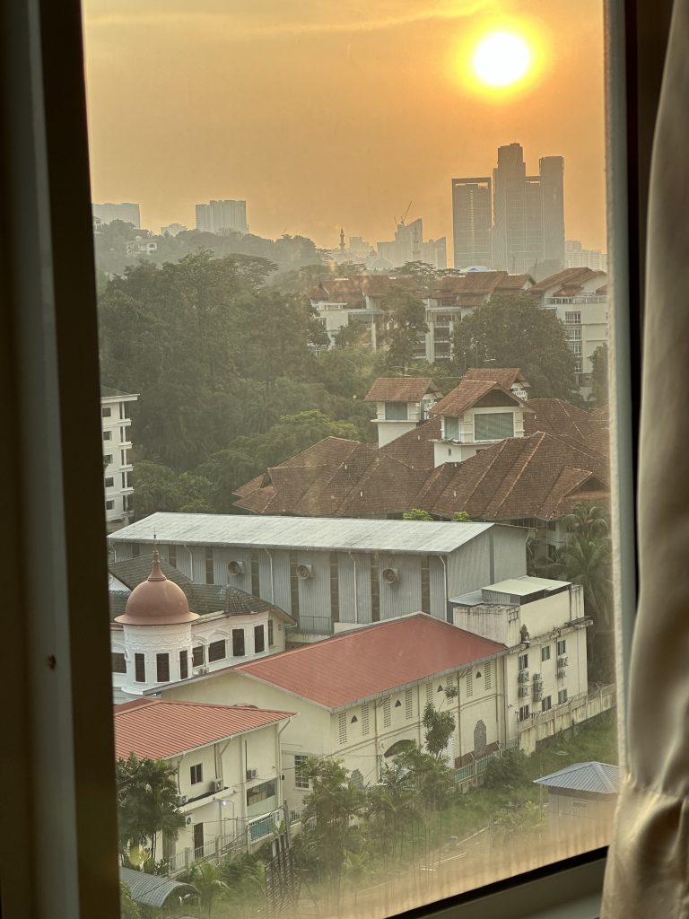 Sun_setting_over_kuala_lumpur_city_view_solo_woman_travel_stef_barti