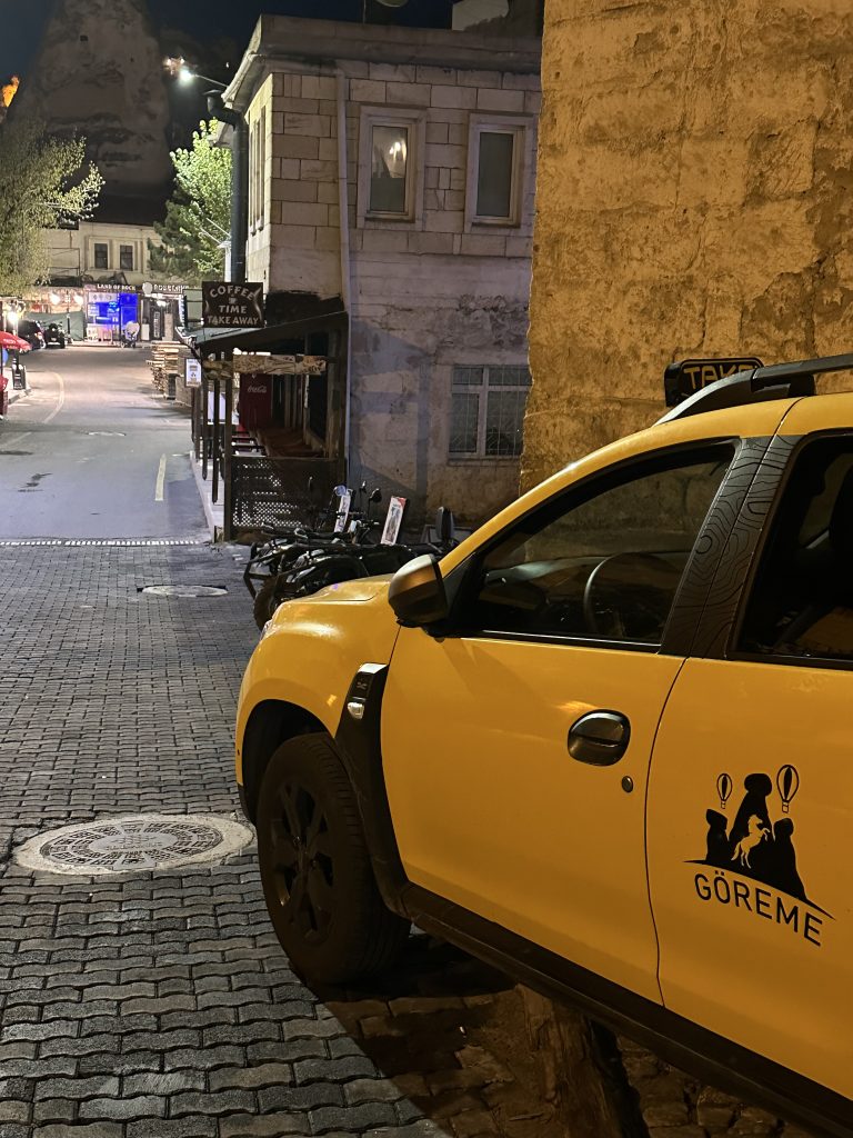 taxi and street at night in Goreme
