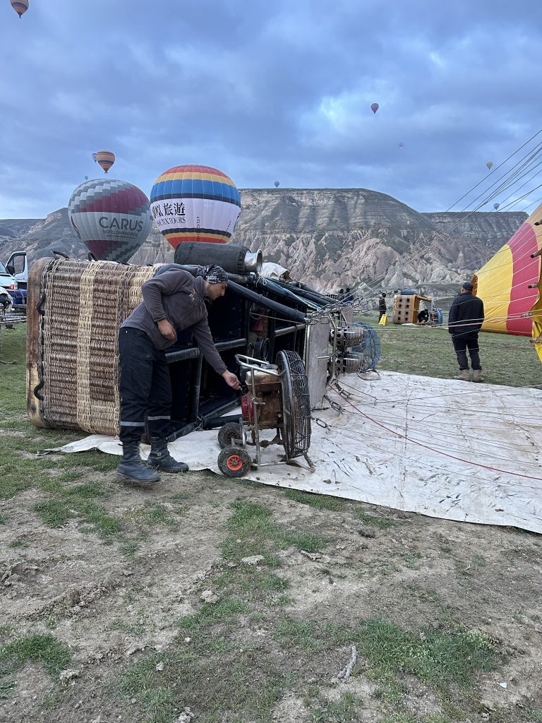 workers getting the balloons ready for a cappadocia hot air balloon ride 