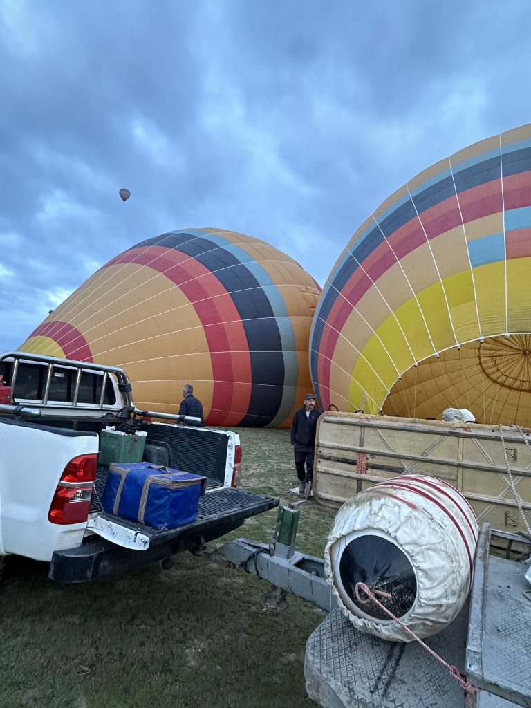 workers getting the balloons ready for a cappadocia hot air balloon ride 