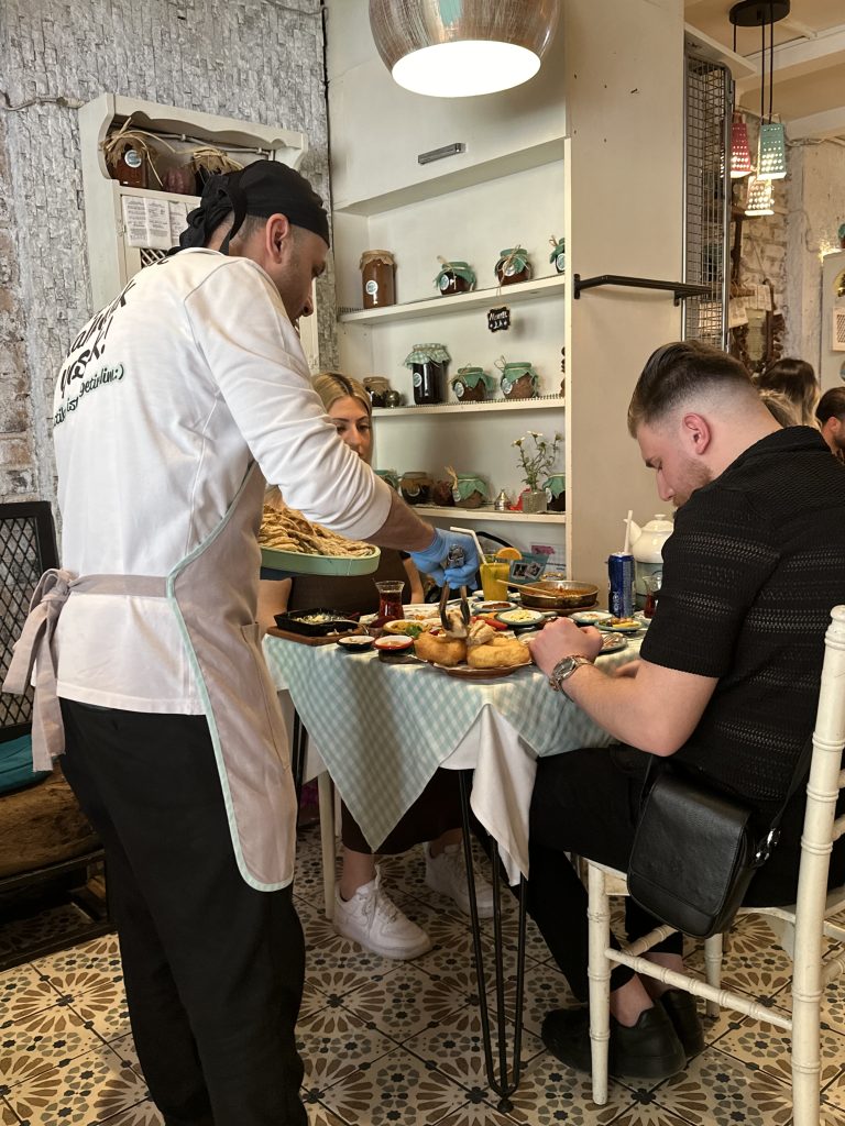 waiter serving bread at Bazlama Istanbul