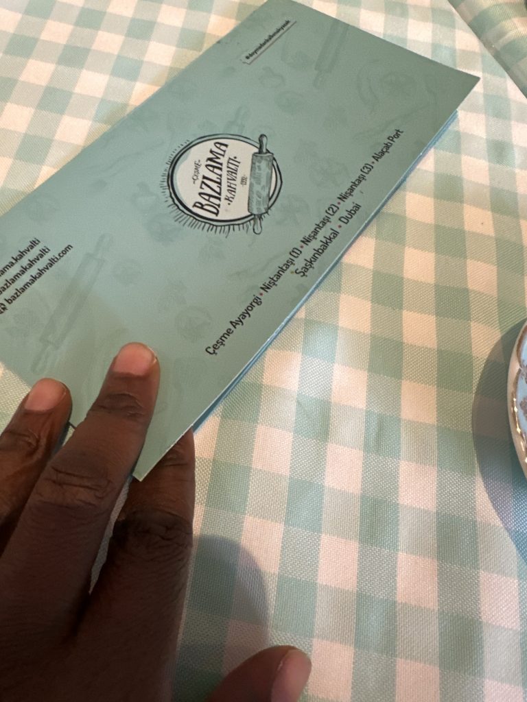 picking up the cheque at Bazlama