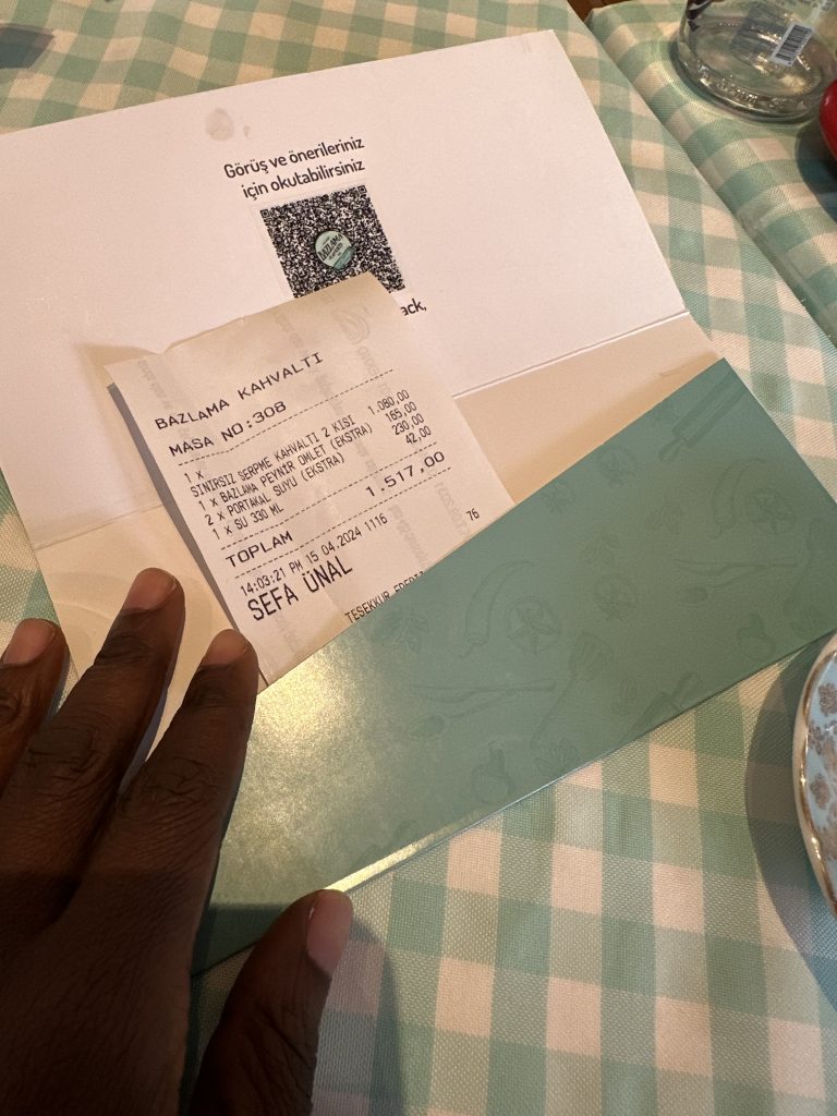picking up the cheque at Bazlama