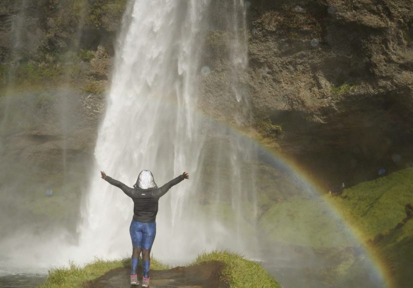 Stef Barti posing at a waterfall in Iceland