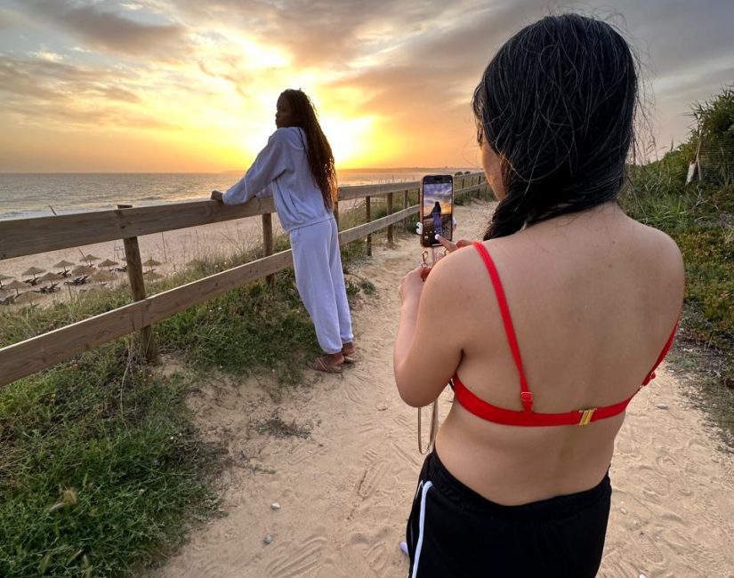 girls taking selfie albufeira sunset
