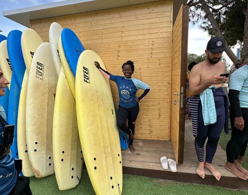 Stef Barti picking a surf board at surf Albufeira surf school