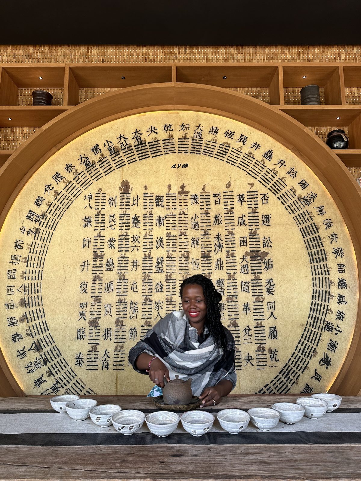 stef barti pouring tea at a tea ceremony in Bali